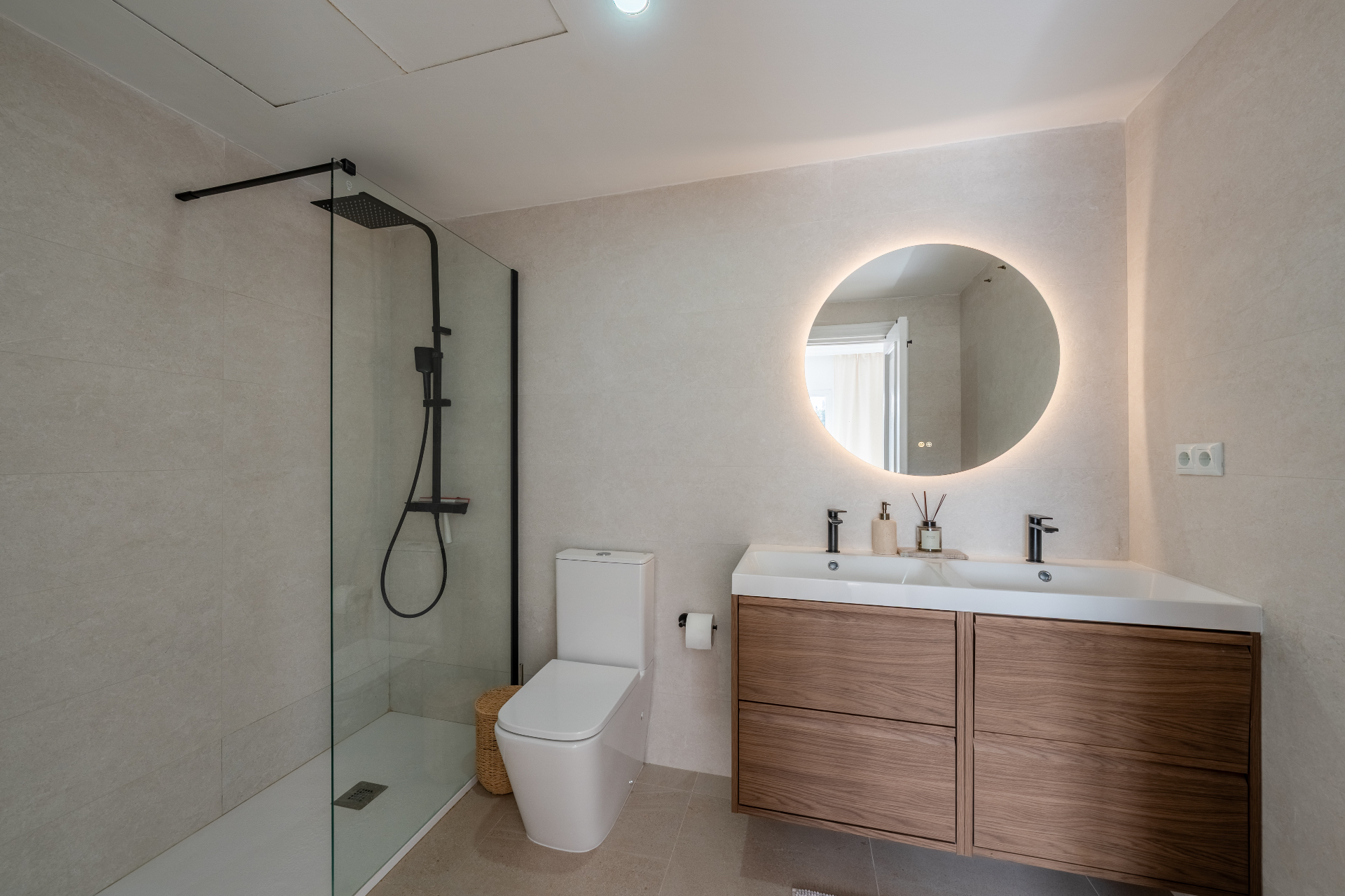 Bathroom in warm stone and walnut